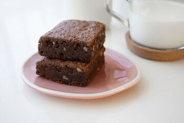 two brownies on a pink plate