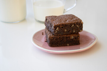 two brownies on a pink plate