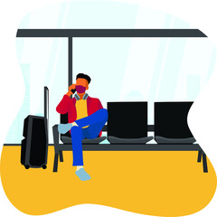 A man waiting for the airplane at the airport waiting room