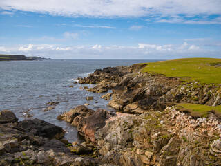 Dramatic coastal scenery around Inna Ness near Breckon on the island of Yell, Shetland, Scotland, UK - eroded, fragmented metamorphic bedrock