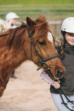 girl leading her horse