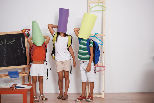 3 fun brothers. They hide their faces with colored cardstock