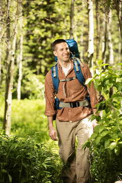 Man Hiking in the Backwoods