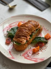 Salmon snack with baby carrots and cherry tomatoes, blurred and soft focus background