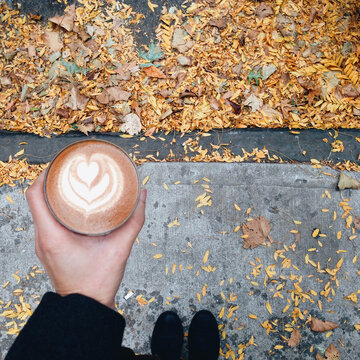 Holding a cortado in the autumn