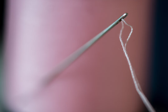 Needle and Thread in Spool of Thread