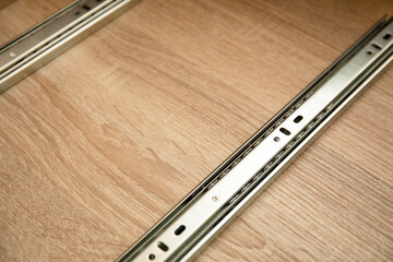 Roller guides for installation during furniture assembly