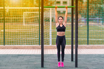 Young woman working out at sunrise