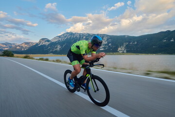 Fototapeta premium triathlon athlete riding bike
