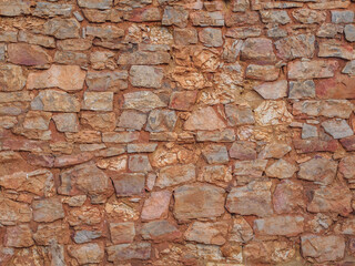 Old clay stone wall background, texture