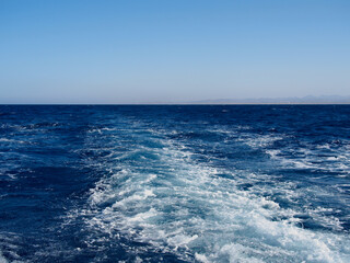 Naklejka na ściany i meble Cruise ship wake on the sea surface, ocean boat foam trail