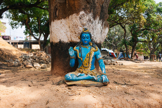 Statue of Lord Shiva underneath a tree.