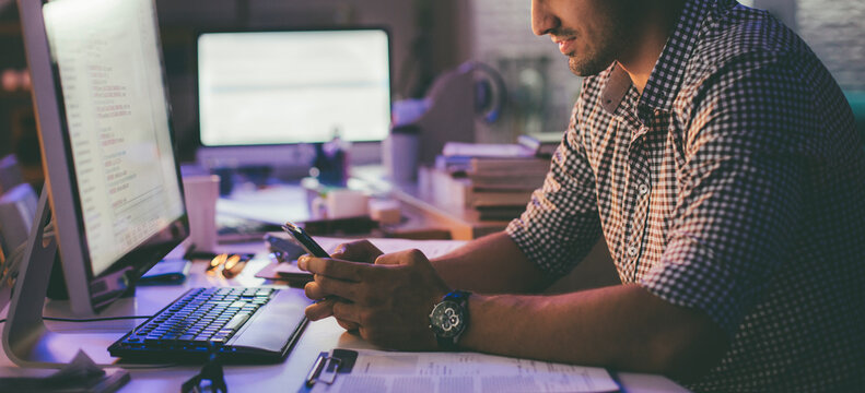 Programmer Texting at His Office
