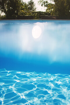 Beneath the water and under the water sight of a swimming pool