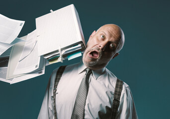 Paperwork hitting a businessman's head