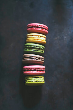 French macaroons on a black background