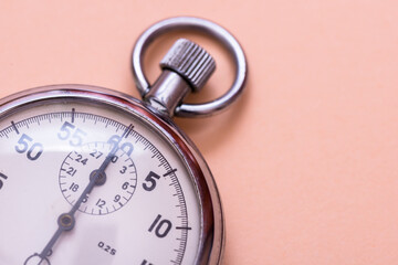 Vintage stopwatch on beige background, copy space