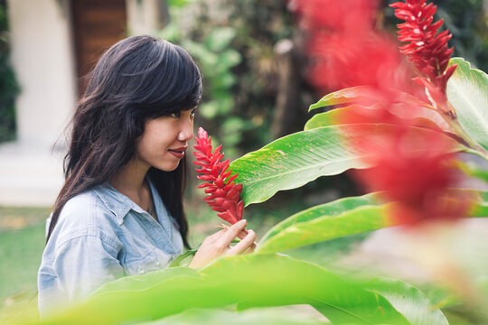woman smelling flowers