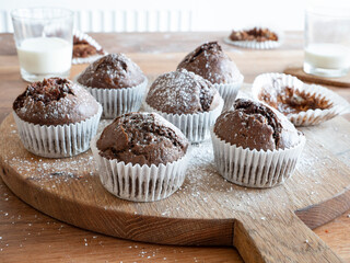 Chocolate Banana Cupcakes with powdered sugar shot in natural light.