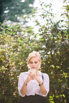 Young woman texting on her cellphone