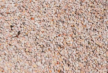Decorative pebble stone background, beige to pink colors garden ground cover 