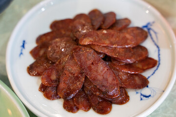 Close view of a set of sliced Sichuan sausages.