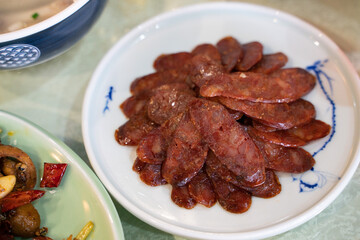 Close view of a set of sliced Sichuan sausages.