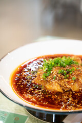 cold boiled pork with garlic puree, a traditional Sichuan cuisine dish in China, with Sichuan red pepper sauce.