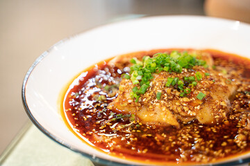 cold boiled pork with garlic puree, a traditional Sichuan cuisine dish in China, with Sichuan red pepper sauce.