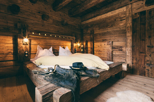 interior of a wooden alpine cabin - bedroom