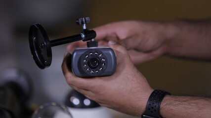 A man repairing CCTV camera in service center  
