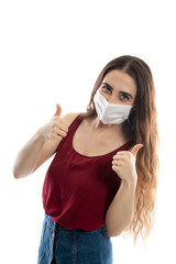 Young woman wearing medical face mask, studio portrait