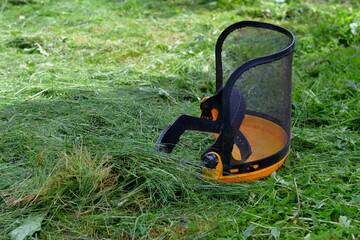protective helmet for the mower on cut grass