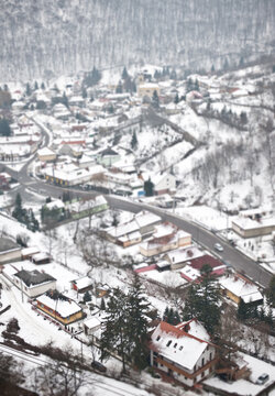 Tilt shift perspective of a small town covered with snow in winter