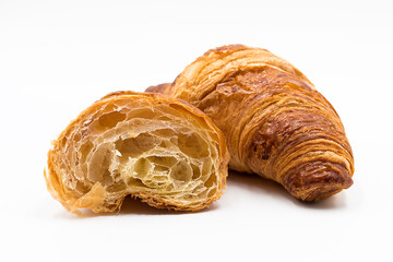 Croissant open in half a white background. The texture of croissants