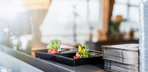 Naklejka na ściany i meble Sushi at the serving desk at the restaurant