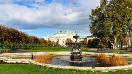 Fototapeta na wymiar Vienna fountain, park, and Baroque architecture.