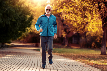 Fototapeta premium Senior fitness man doing workout outdoors