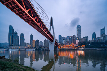 Fototapeta na wymiar Night view of the Qiansimen bridge and the skyline in Chongqing, China.