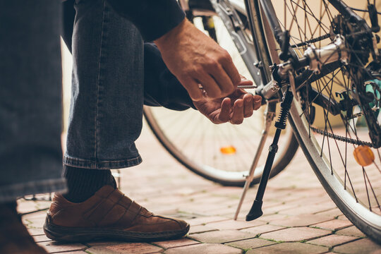 Real reparing of bicycle in the court pavement