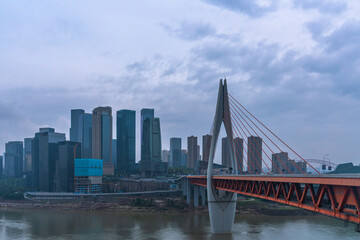 Fototapeta na wymiar Panorama view of the Qiansimen bridge and skyline in Chongqing, China, on a cloudy day.