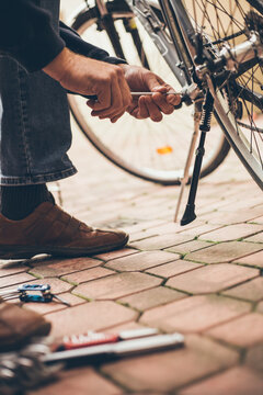 Real reparing of bicycle in the court pavement