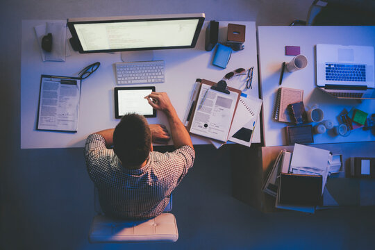 Caucasian Programmer Working at His Office at Night