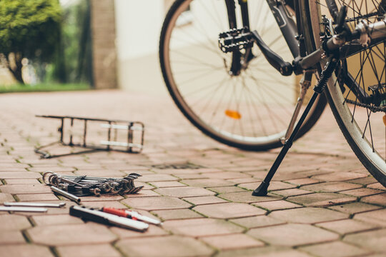 Real reparing of bicycle in the court pavement