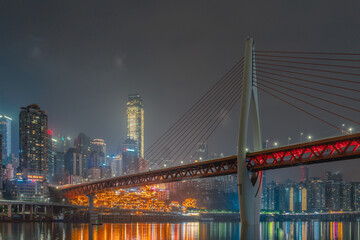 Fototapeta na wymiar Night view of the Qiansimen bridge and the skyline in Chongqing, China.