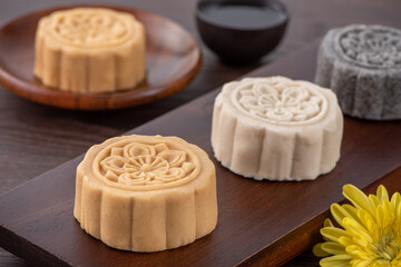 Colorful beautiful moon cake, mung bean cake, Champion Scholar Pastry cake for Mid-Autumn festival traditional gourmet dessert snack, close up.