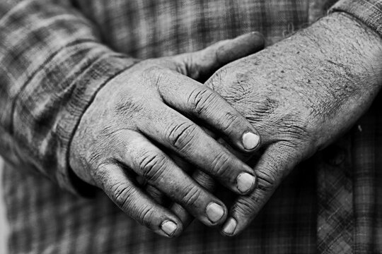 A Man's hands after working on a car.