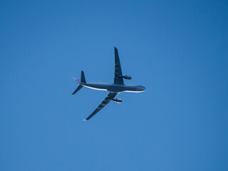 Aeroplane flying high above Sydney Harbour Australia