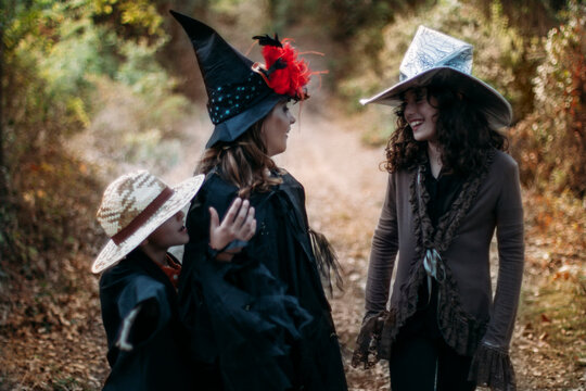 Three kids having fun wearing halloween costume
