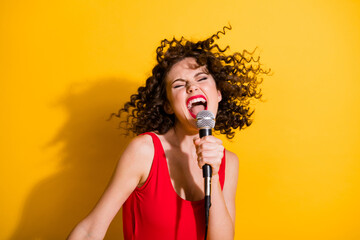 Closeup portrait photo of cute crazy young girl hand hold mic open mouth eyes closed sing funky...